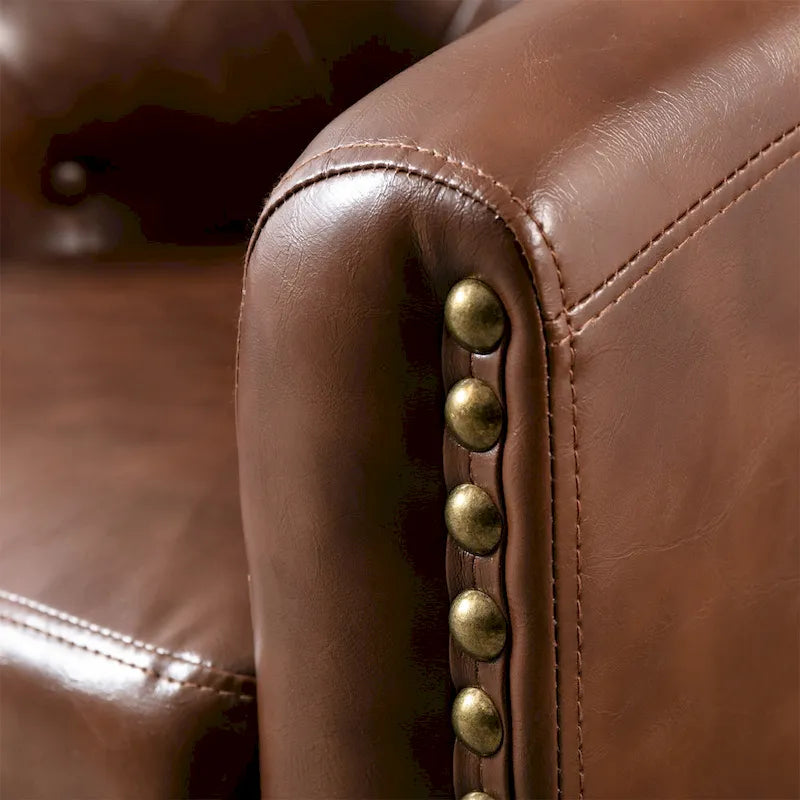 Fauteuil de club contemporain en similicuir PU avec accoudoirs encastrés et garniture cloutée